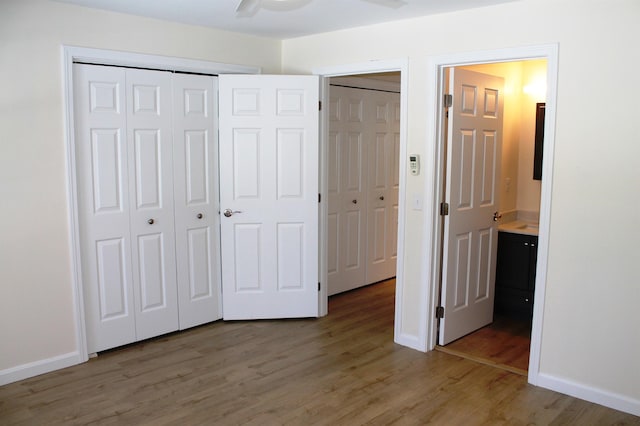 unfurnished bedroom featuring light wood-style floors and baseboards