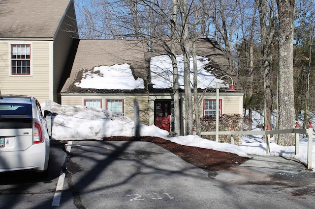 view of front of house featuring roof with shingles