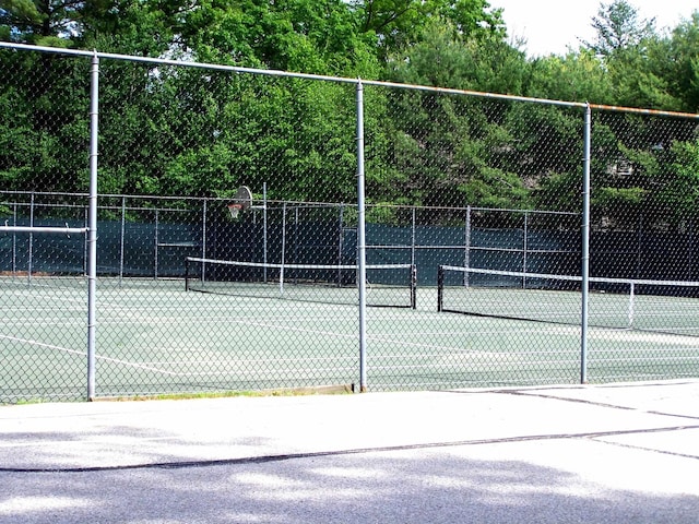 view of sport court with community basketball court and fence