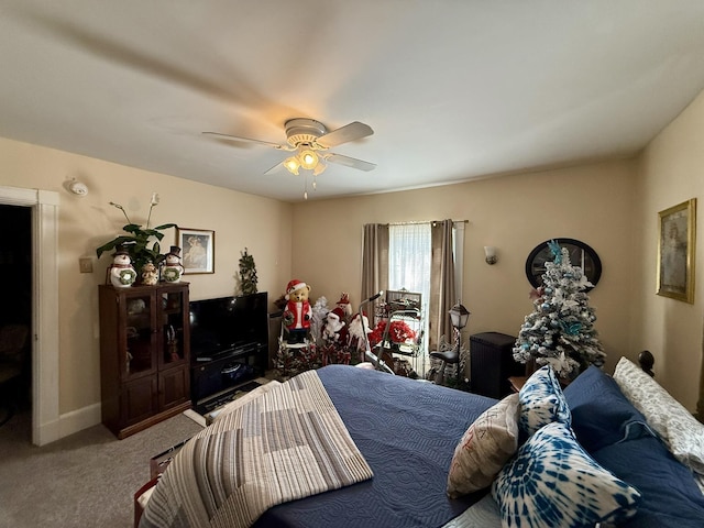 bedroom featuring carpet, baseboards, and ceiling fan