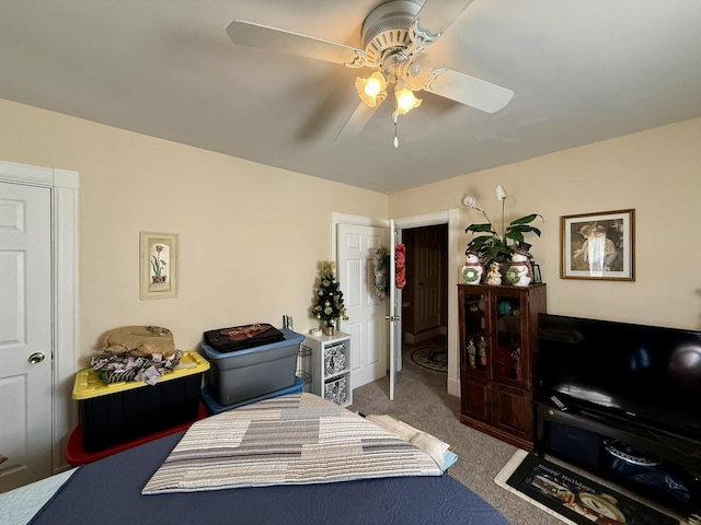 carpeted bedroom featuring a ceiling fan