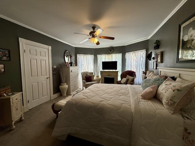 carpeted bedroom featuring ceiling fan and crown molding