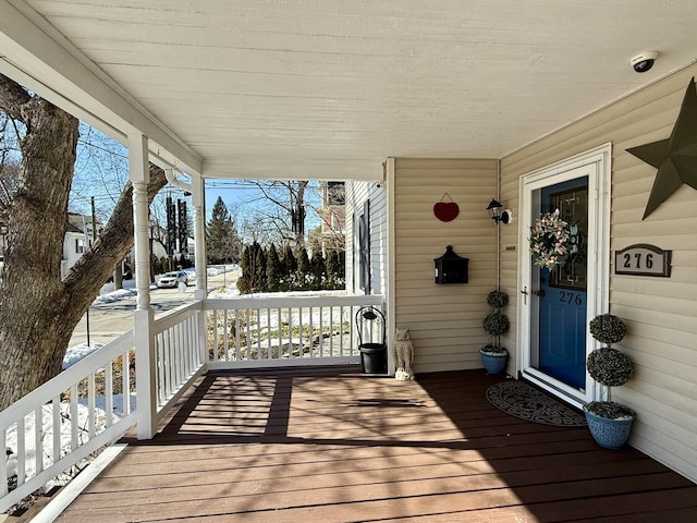 wooden terrace with a porch