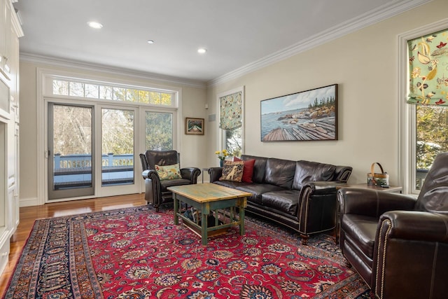 living room with recessed lighting, crown molding, and wood finished floors