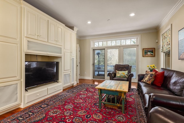 living area with ornamental molding, recessed lighting, wood finished floors, and baseboards