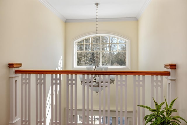 interior details with ornamental molding and a notable chandelier