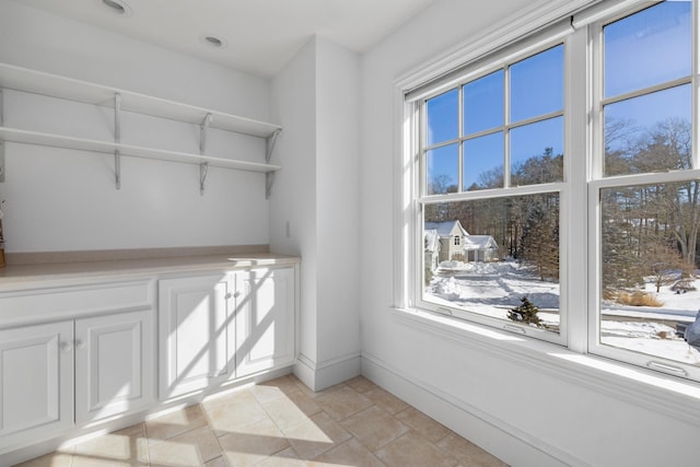 interior space featuring baseboards