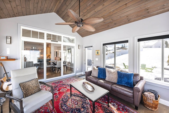 living area with lofted ceiling, a ceiling fan, wood ceiling, wood finished floors, and baseboards