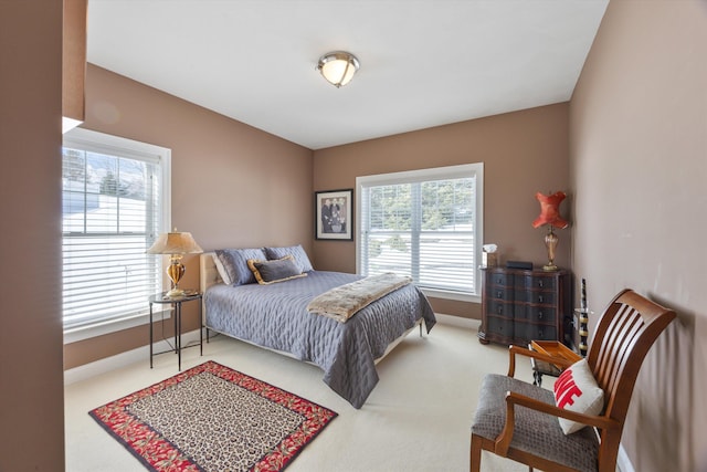 bedroom with carpet floors and baseboards