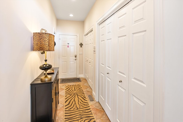 entryway featuring visible vents and recessed lighting