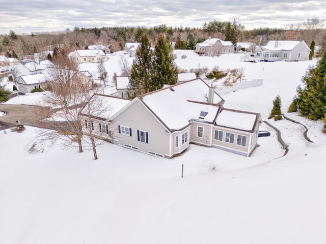 snowy aerial view featuring a residential view