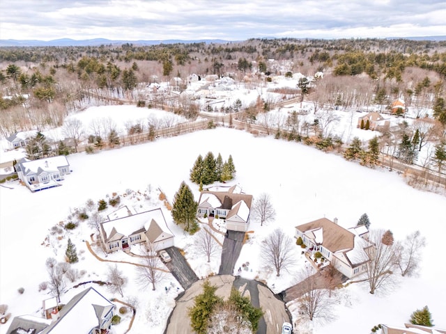 snowy aerial view with a mountain view