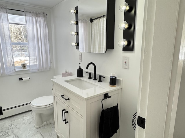 bathroom with toilet, marble finish floor, a baseboard radiator, and vanity