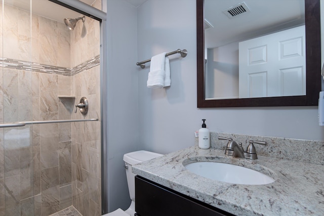 full bath featuring a stall shower, visible vents, and vanity