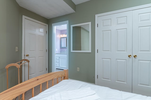 bedroom with a closet and ensuite bathroom