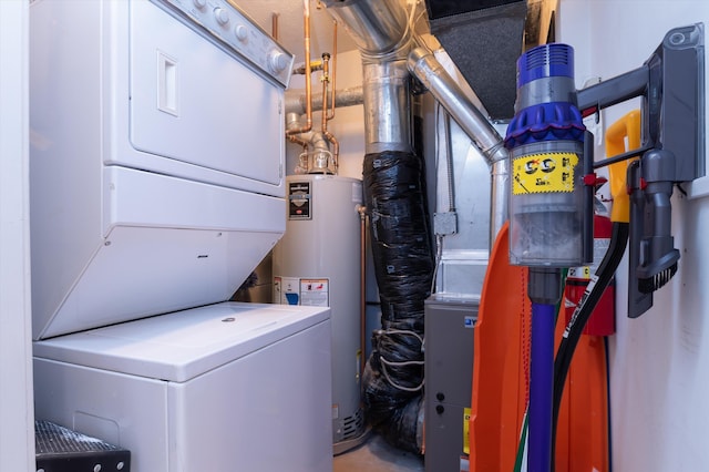 clothes washing area with stacked washer and dryer, gas water heater, laundry area, and heating unit