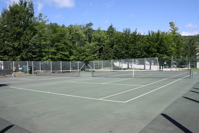 view of sport court with fence