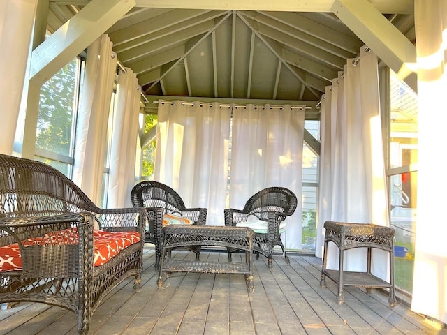 sunroom featuring vaulted ceiling