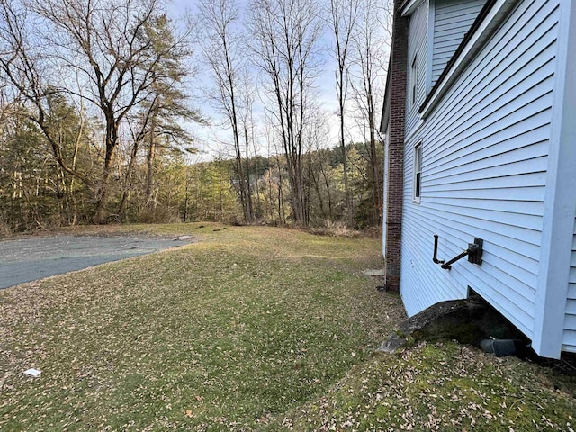 view of yard featuring a view of trees