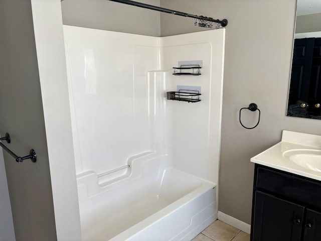 full bathroom featuring shower / bathing tub combination, vanity, baseboards, and tile patterned floors