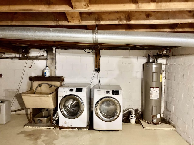 laundry area with washer and dryer, laundry area, electric water heater, and a sink