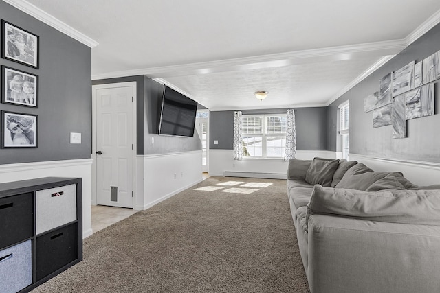 living area with a wainscoted wall, a baseboard radiator, ornamental molding, and light colored carpet