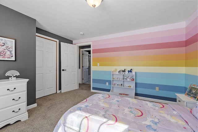 bedroom with carpet floors, a closet, and baseboards