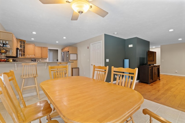 dining space featuring light tile patterned floors, ceiling fan, baseboards, and recessed lighting