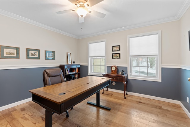 home office featuring plenty of natural light, crown molding, ceiling fan, and hardwood / wood-style floors