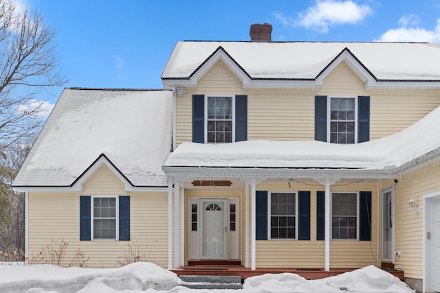 view of front of home with a chimney