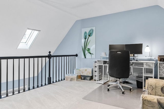 carpeted office with lofted ceiling with skylight