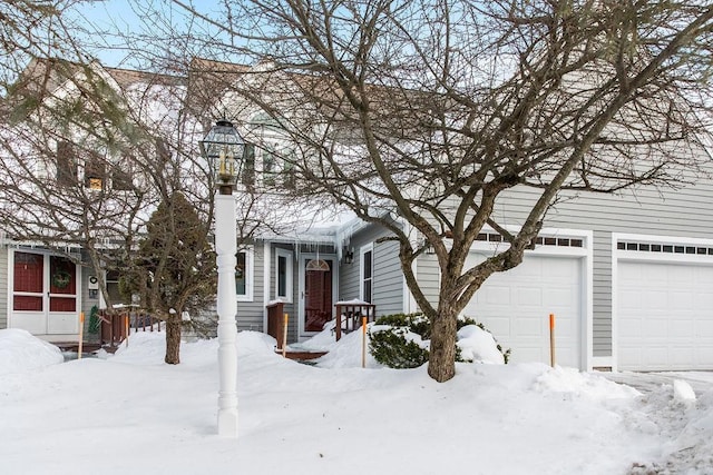 view of front of home with a garage and a chimney