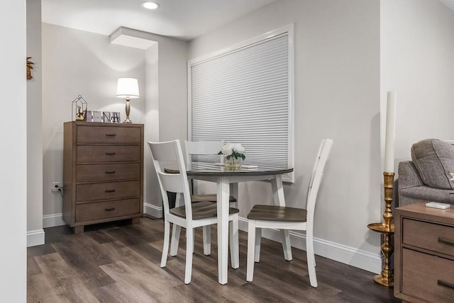 dining room with baseboards, dark wood-type flooring, and recessed lighting