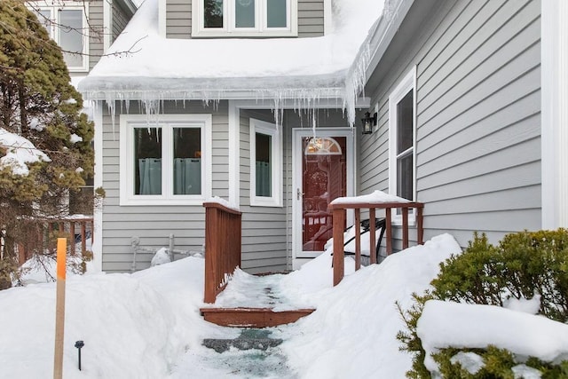 view of snow covered property entrance