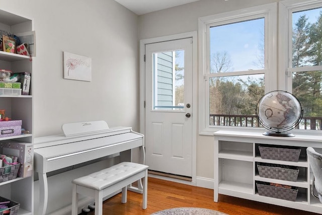 entryway featuring light wood-style flooring and baseboards