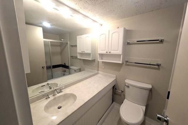 bathroom featuring baseboards, toilet, and vanity