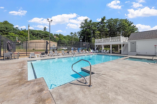 pool featuring a patio and fence