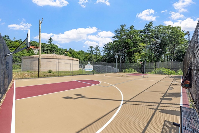 view of sport court with community basketball court and fence