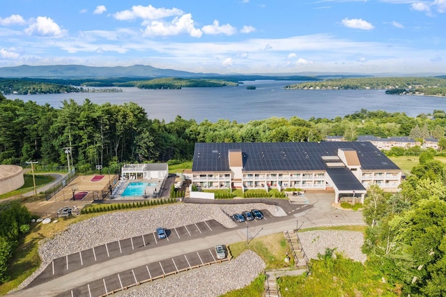 drone / aerial view with a water and mountain view