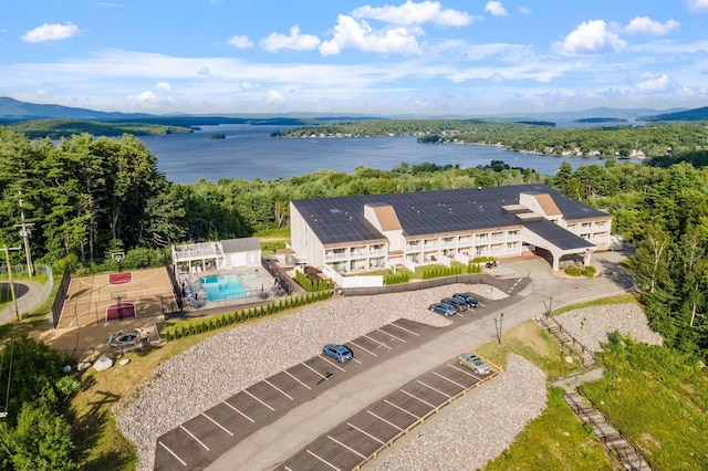 aerial view featuring a view of trees and a water view