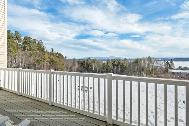 wooden deck with a mountain view