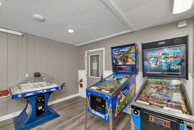 recreation room featuring wood finished floors