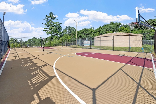 view of sport court featuring community basketball court and fence