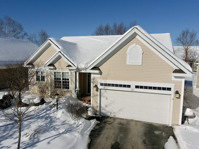 view of front of property with a garage and concrete driveway