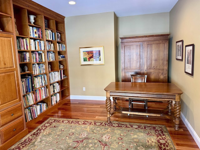 office area with baseboards, wood finished floors, and recessed lighting