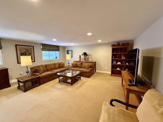 living room featuring recessed lighting, light colored carpet, and baseboards