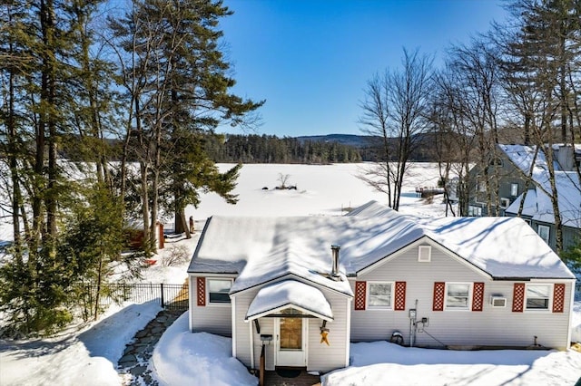 view of front of home featuring fence