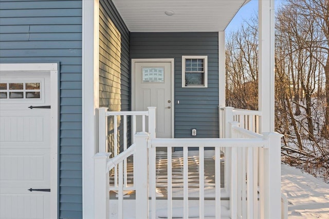 view of exterior entry featuring a porch