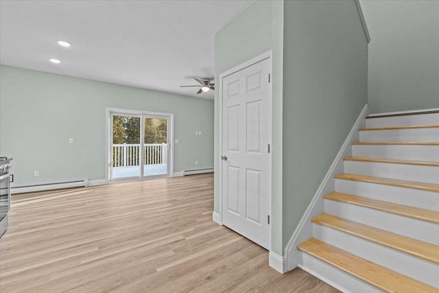 stairs featuring a baseboard radiator, recessed lighting, wood finished floors, baseboards, and baseboard heating