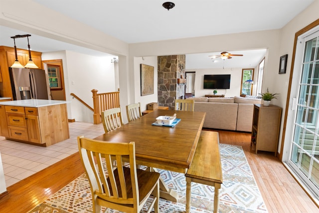 dining area featuring ceiling fan and light wood-style flooring